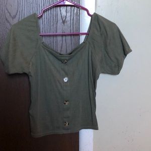 green cropped off the shoulder shirt